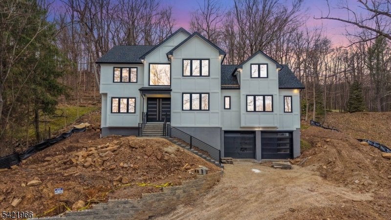 85 Pine Brook Road Montville, NJ 07082 - Photo 2 of 50 a front view of a house with a yard and garage