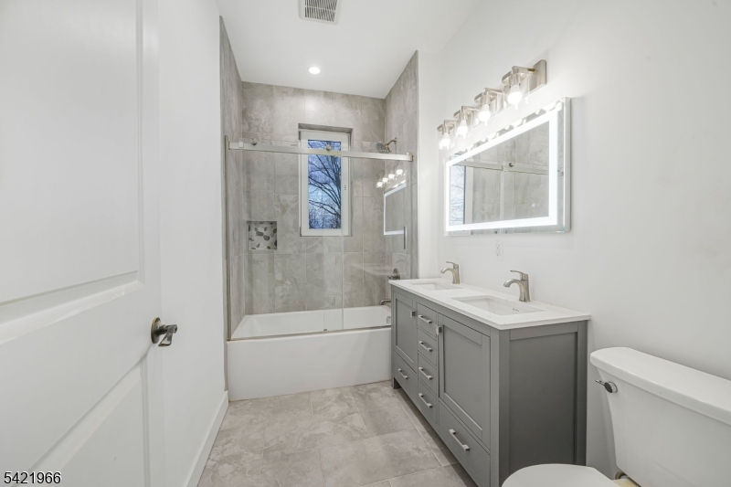 85 Pine Brook Road Montville, NJ 07082 - Photo 27 of 50 a bathroom with a tub sink toilet and a mirror