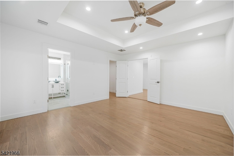 85 Pine Brook Road Montville, NJ 07082 - Photo 31 of 50 an empty room with fan and a ceiling fan