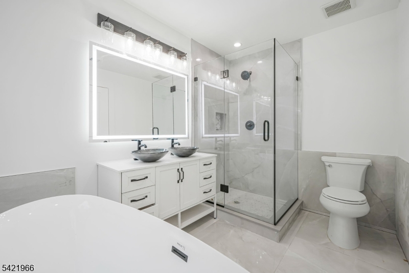 85 Pine Brook Road Montville, NJ 07082 - Photo 32 of 50 a bathroom with a toilet sink and shower