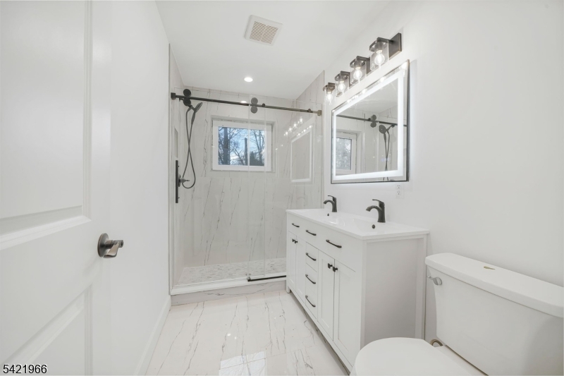 85 Pine Brook Road Montville, NJ 07082 - Photo 36 of 50 a bathroom with a sink a toilet and shower