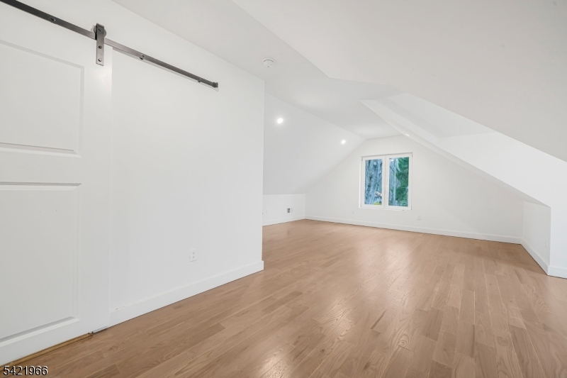 85 Pine Brook Road Montville, NJ 07082 - Photo 39 of 50 a view of an empty room with wooden floor and a window