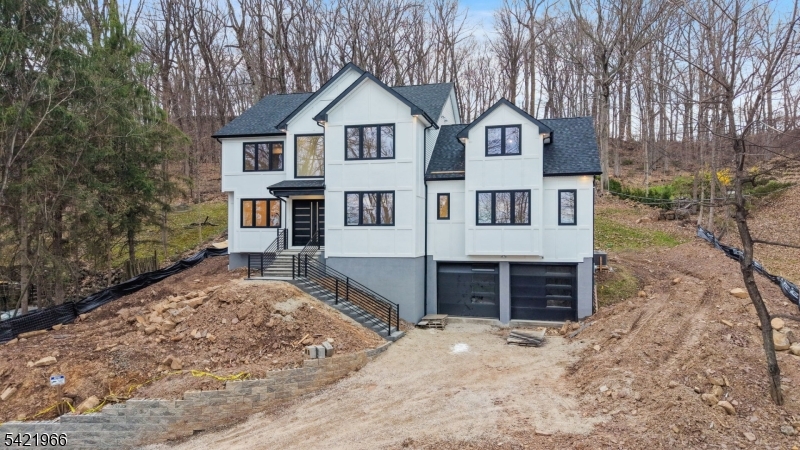85 Pine Brook Road Montville, NJ 07082 - Photo 4 of 50 front view of a house with a yard and trees