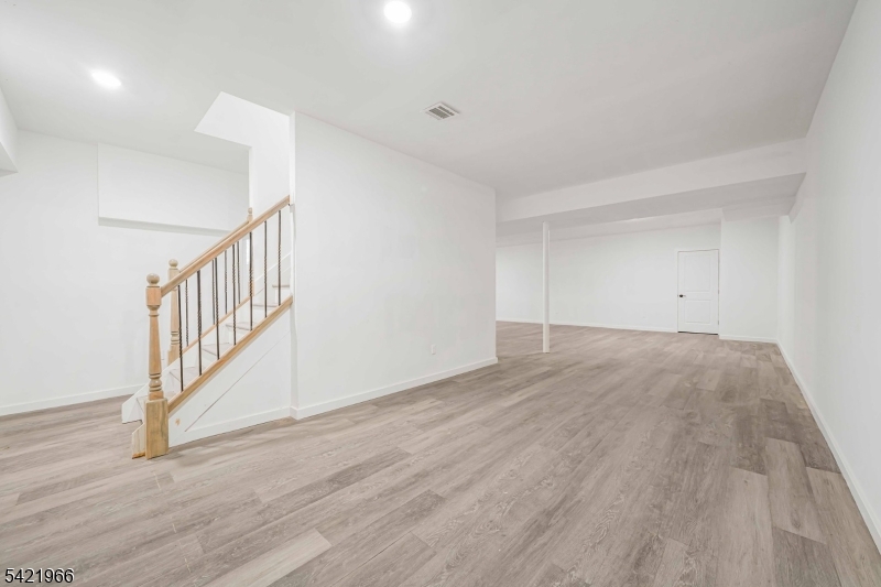 85 Pine Brook Road Montville, NJ 07082 - Photo 41 of 50 a view of an empty room with wooden floor