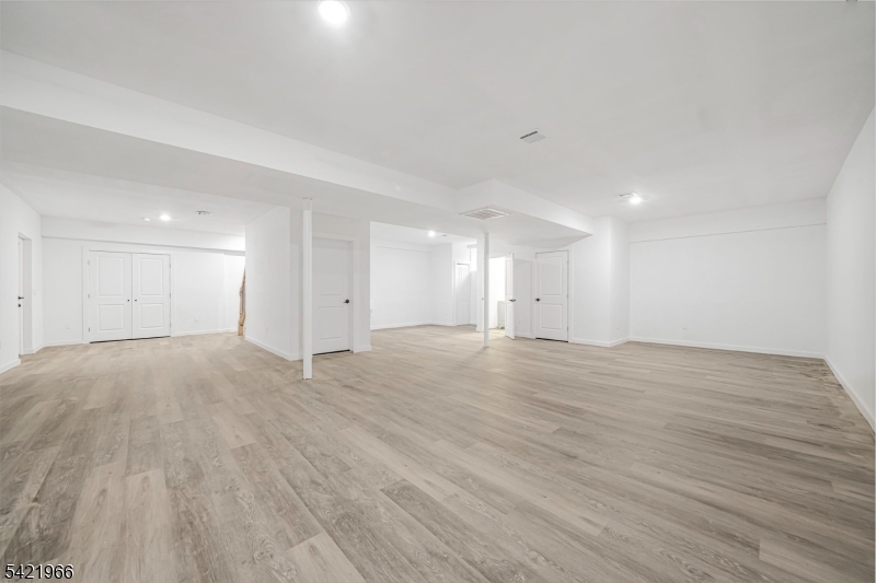85 Pine Brook Road Montville, NJ 07082 - Photo 42 of 50 a view of an empty room with wooden floor