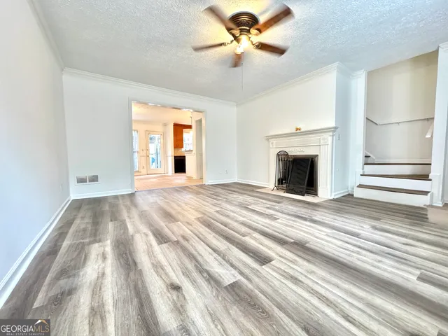 a view of empty room with a fireplace