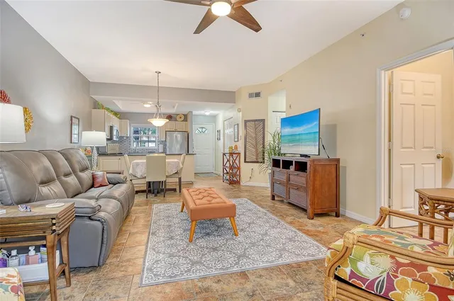 a kitchen with stainless steel appliances granite countertop white cabinets and a sink