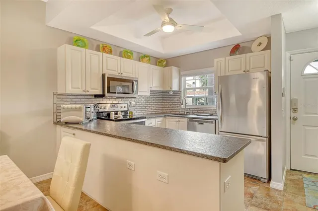 a bathroom with double sink and a mirror