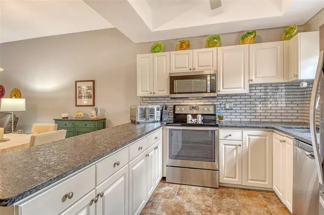 a bedroom with a bed a table and chair