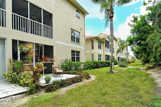 a view of a chairs and table in the patio