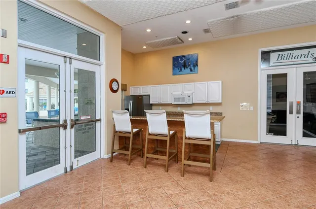 a view of a patio with a table and chairs
