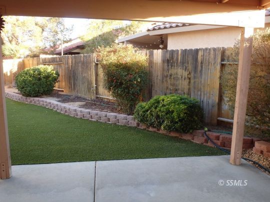 421 Marlene Court Ridgecrest, CA 93555 - Photo 40 of 50 a view of a backyard with plants