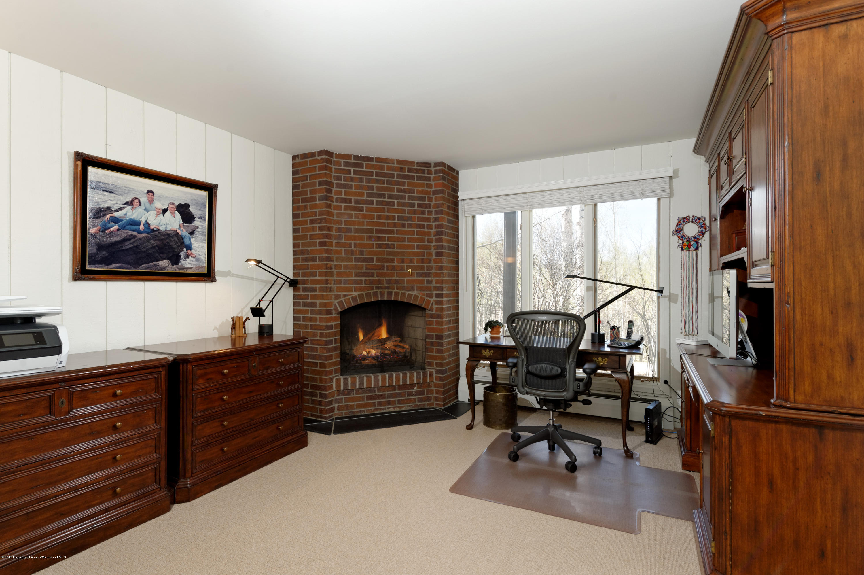 49 Elk Ridge Lane Snowmass Village, CO 81615 - Photo 17 of 24 a living room with furniture a fireplace and a flat screen tv