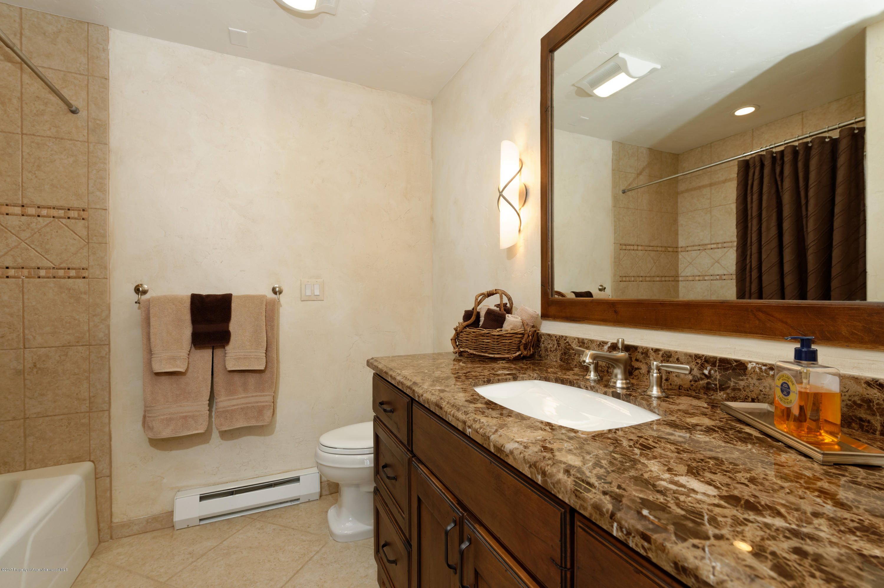 49 Elk Ridge Lane Snowmass Village, CO 81615 - Photo 19 of 24 a bathroom with a granite countertop sink toilet and shower