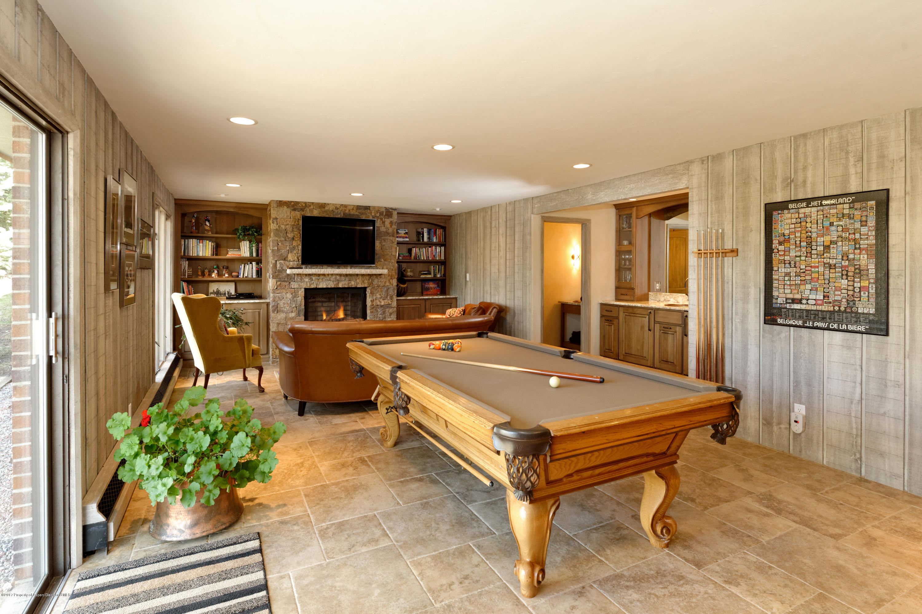 49 Elk Ridge Lane Snowmass Village, CO 81615 - Photo 22 of 24 a living room with furniture and a flat screen tv