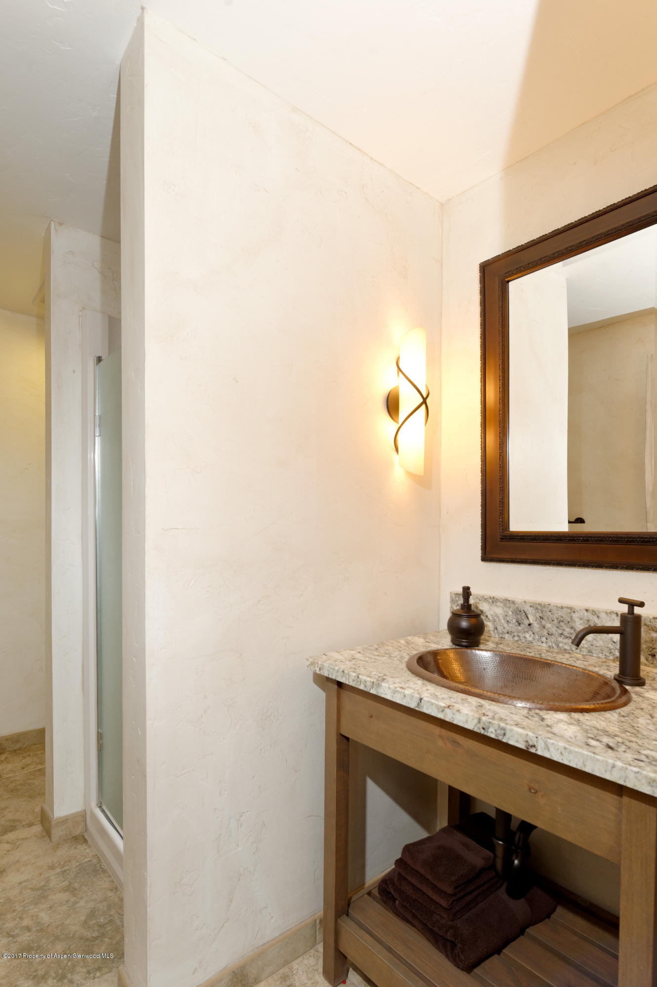 49 Elk Ridge Lane Snowmass Village, CO 81615 - Photo 24 of 24 a bathroom with a sink and a mirror