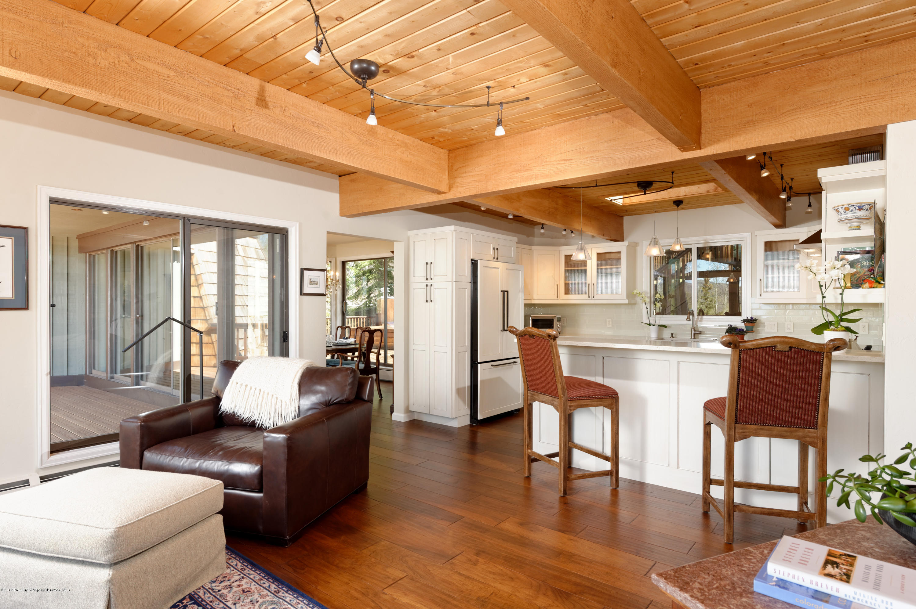 49 Elk Ridge Lane Snowmass Village, CO 81615 - Photo 5 of 24 a living room with fireplace furniture and a wooden floor
