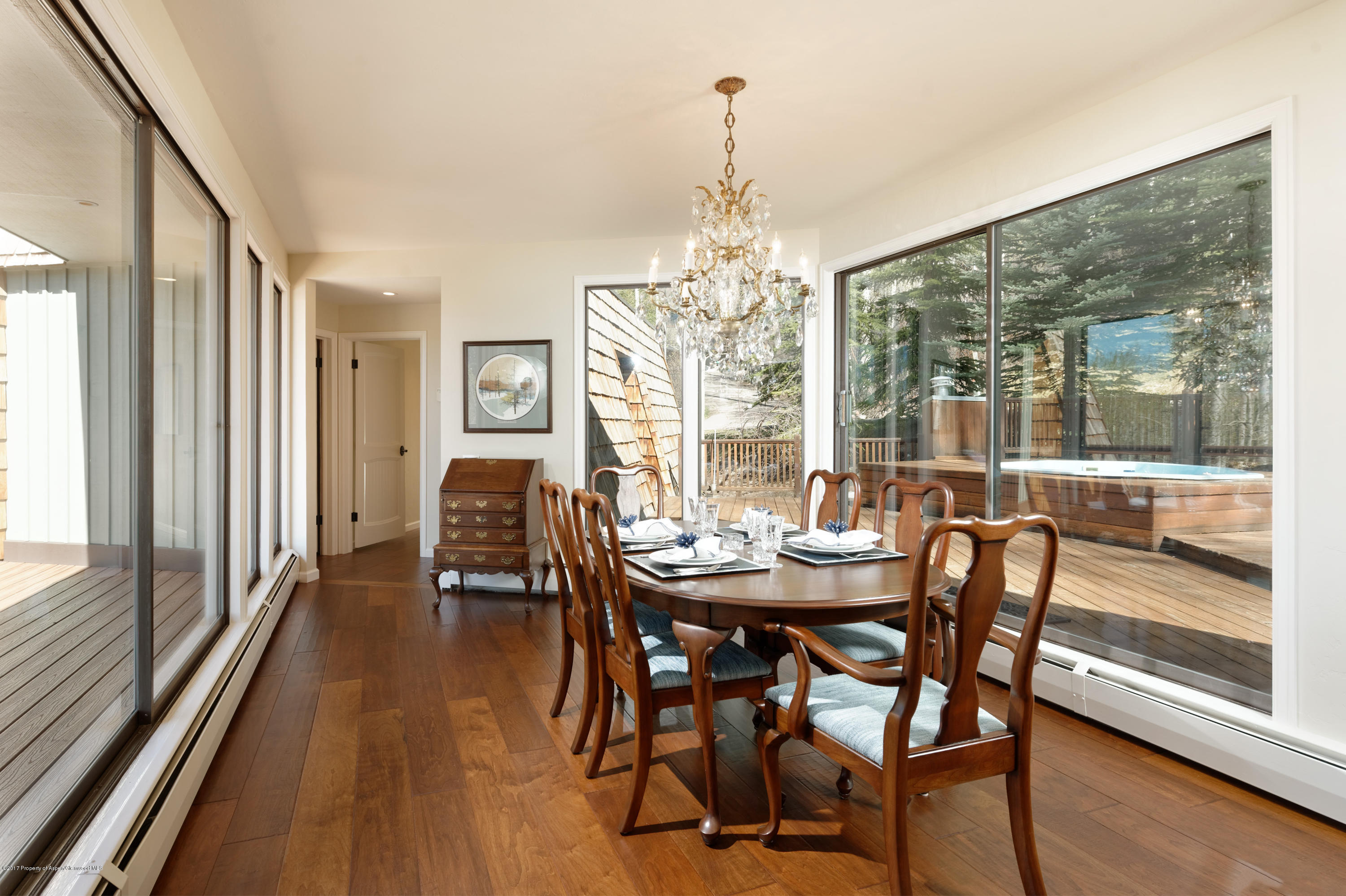 49 Elk Ridge Lane Snowmass Village, CO 81615 - Photo 8 of 24 a view of a dining room with furniture window and wooden floor