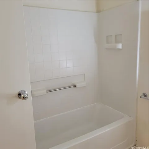 a close view of a bathtub in bathroom