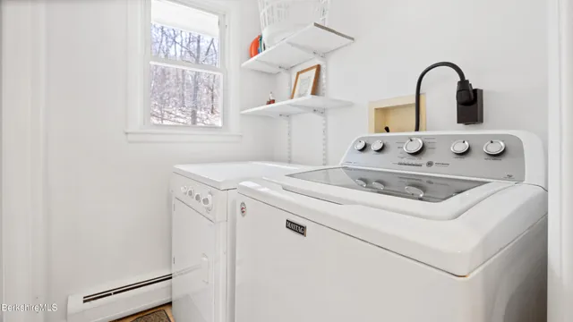 a close view of a sink a stove and refrigerator in a kitchen