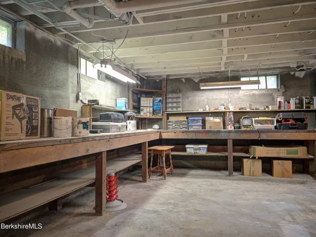 a room with lots of wooden furniture and a table