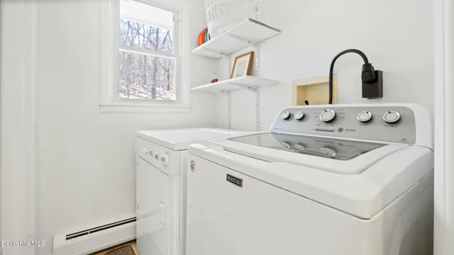 a close view of a sink a stove and refrigerator in a kitchen