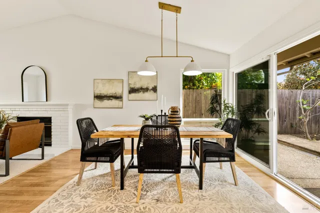 a dining room with furniture and window