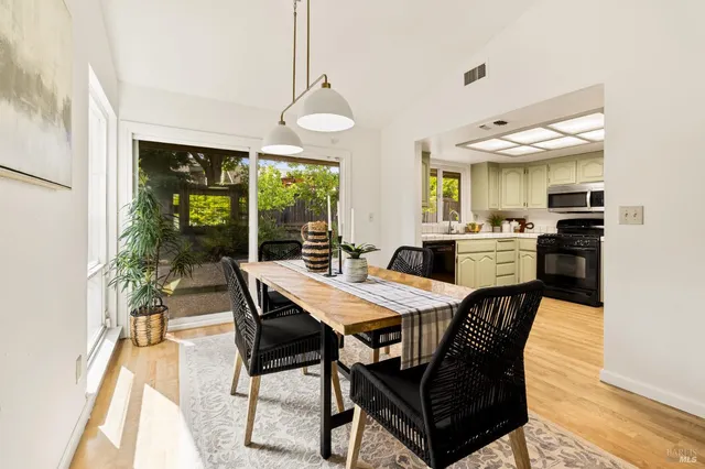 a view of a dining room with furniture window and outside view