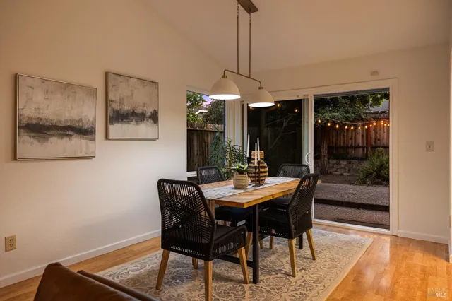 a view of a dining room with furniture and window