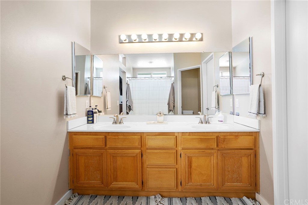 32289 Cercle Beauregard Temecula, CA 92591 - Photo 22 of 45 a bathroom with a sink and a mirror