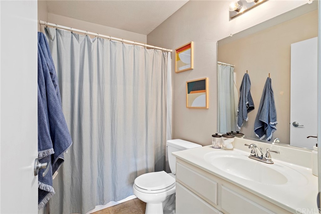 32289 Cercle Beauregard Temecula, CA 92591 - Photo 23 of 45 a bathroom with a sink a toilet and a mirror