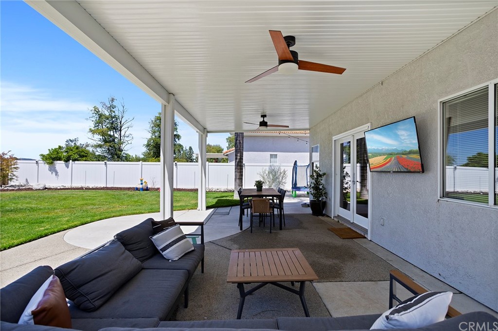 32289 Cercle Beauregard Temecula, CA 92591 - Photo 28 of 45 a view of a patio with table and chairs potted plants with floor to ceiling window