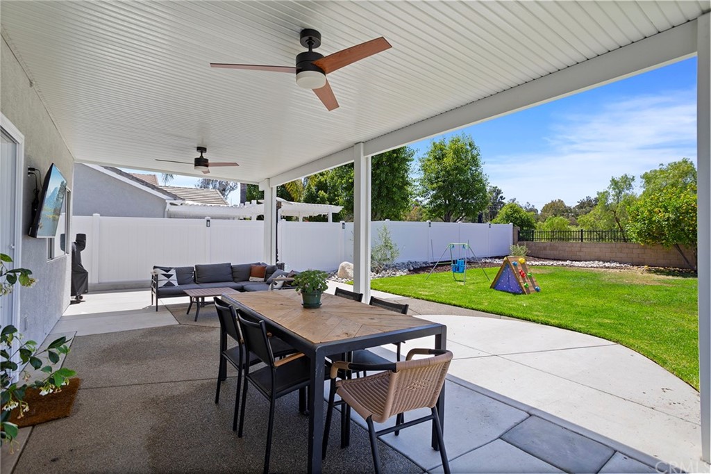 32289 Cercle Beauregard Temecula, CA 92591 - Photo 29 of 45 a view of an outdoor dining space with a table and chairs