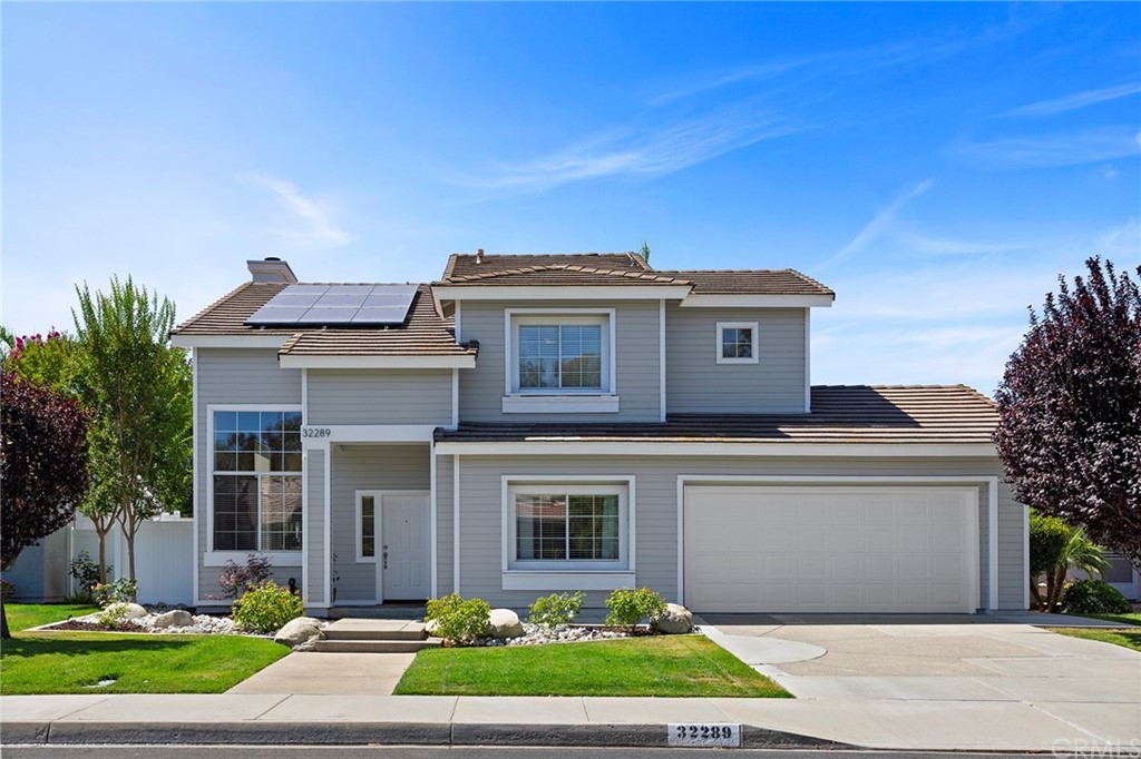 32289 Cercle Beauregard Temecula, CA 92591 - Photo 3 of 45 a front view of a house with a yard and garage