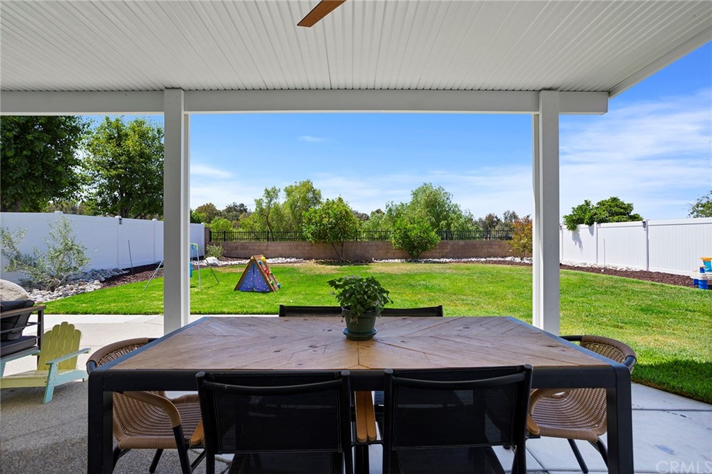 32289 Cercle Beauregard Temecula, CA 92591 - Photo 31 of 45 a view of a dining table and chairs in the garden