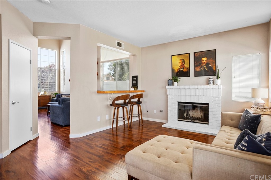 32289 Cercle Beauregard Temecula, CA 92591 - Photo 9 of 45 a living room with furniture and a fireplace