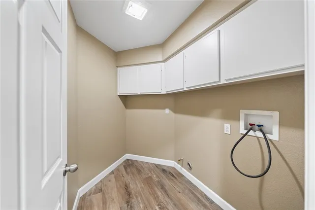 a view of a storage & utility room with racks on the wall