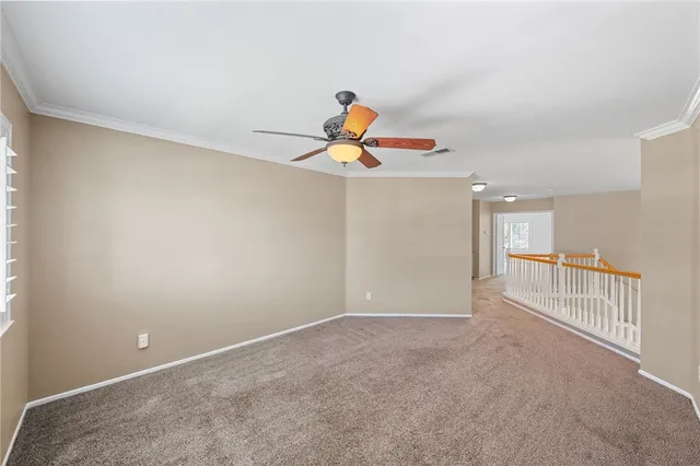 a view of a livingroom with wooden floor and window