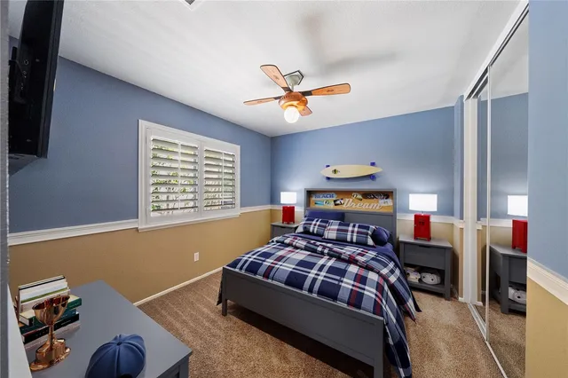 a bedroom with a bed and window