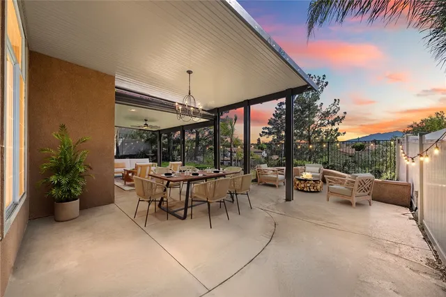 a view of a patio with couches and potted plants