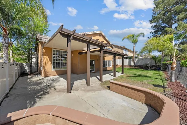 a house view with a backyard space