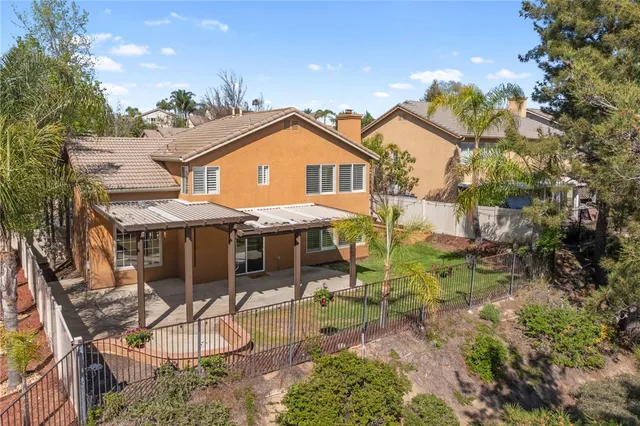 a aerial view of a house with table and chairs