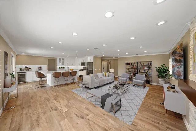 a living room with lots of furniture and a flat screen tv