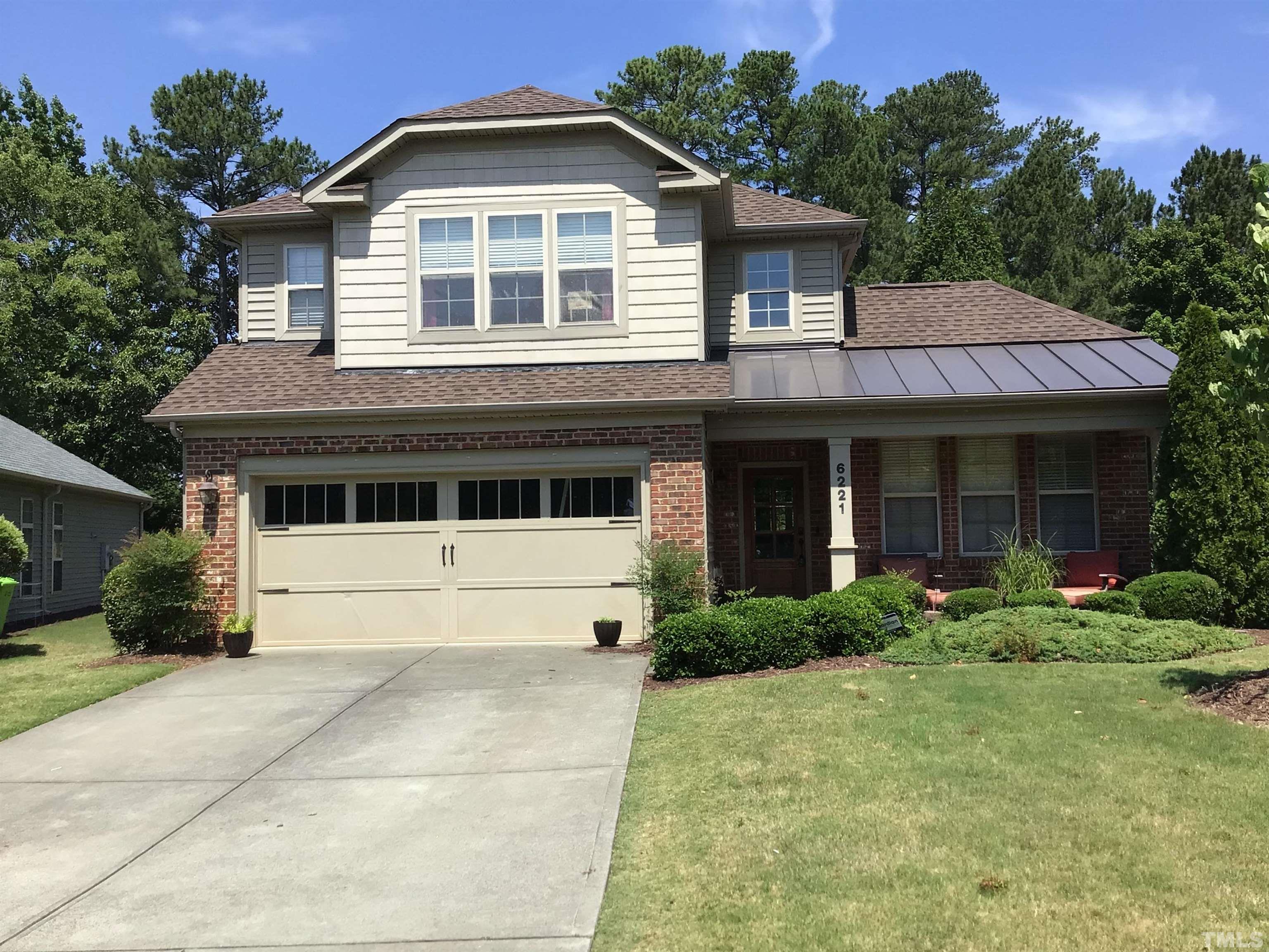 6221 Oconner Street Raleigh, NC 27617 - Photo 1 of 26 a front view of a house with a yard