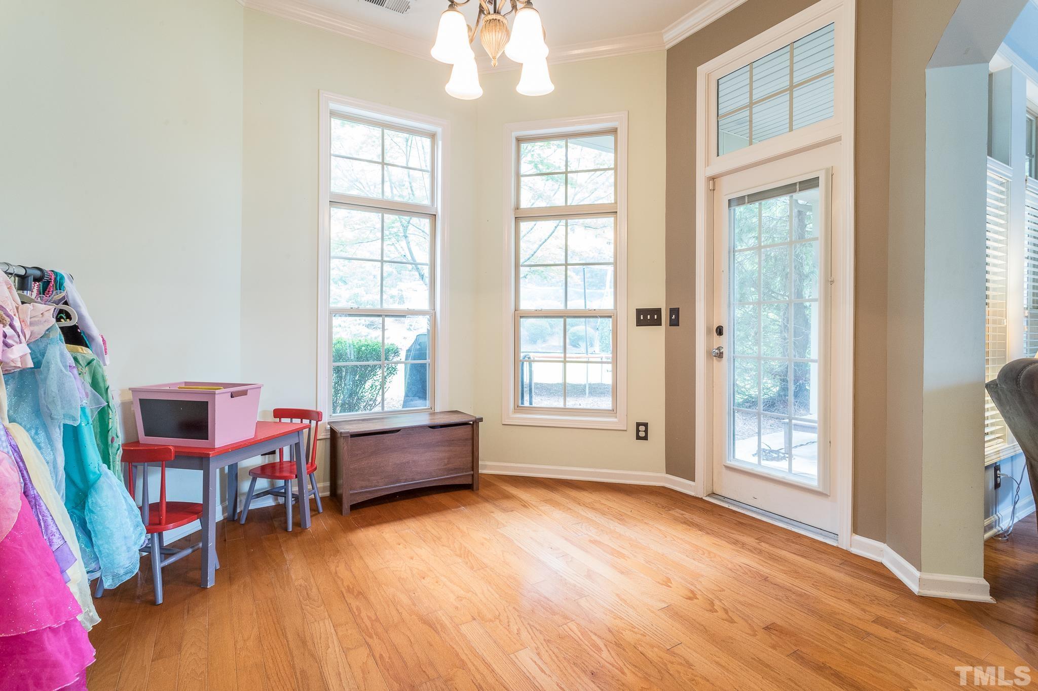 6221 Oconner Street Raleigh, NC 27617 - Photo 12 of 26 a living room with furniture and a window