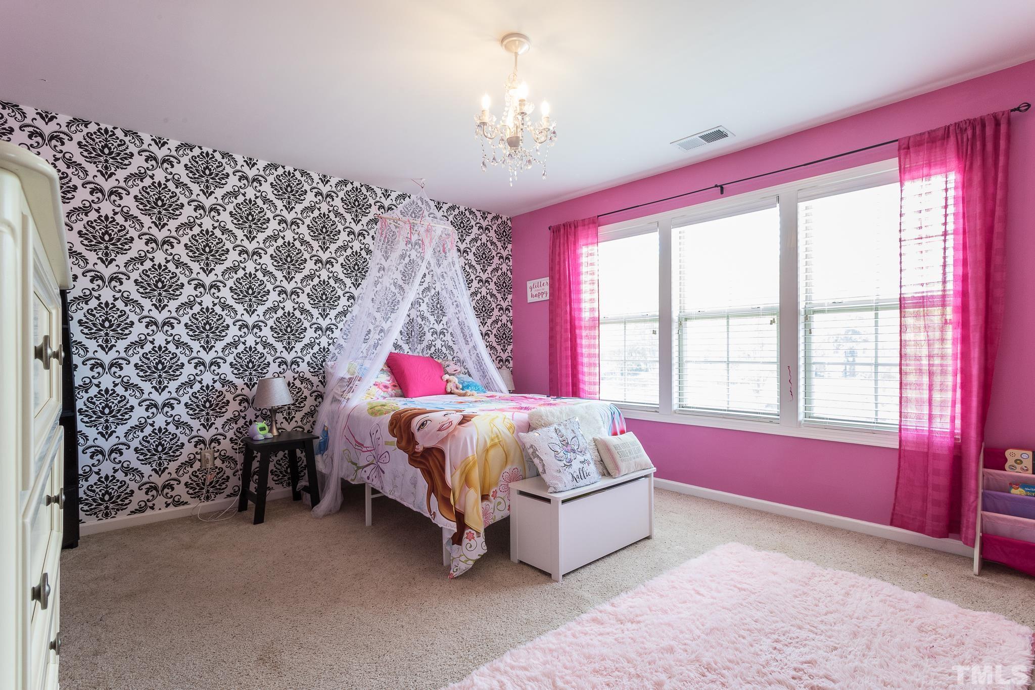 6221 Oconner Street Raleigh, NC 27617 - Photo 14 of 26 a bed room with a bed and a window