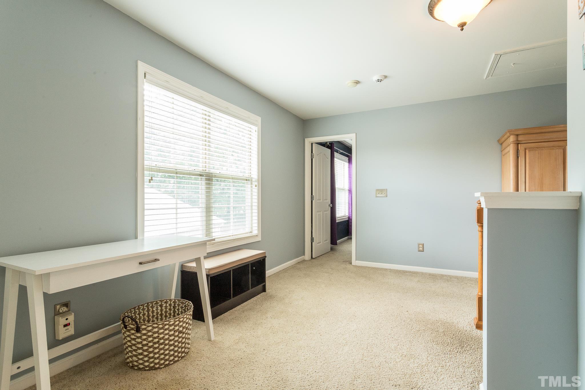 6221 Oconner Street Raleigh, NC 27617 - Photo 16 of 26 a spacious bedroom with a bed and a window