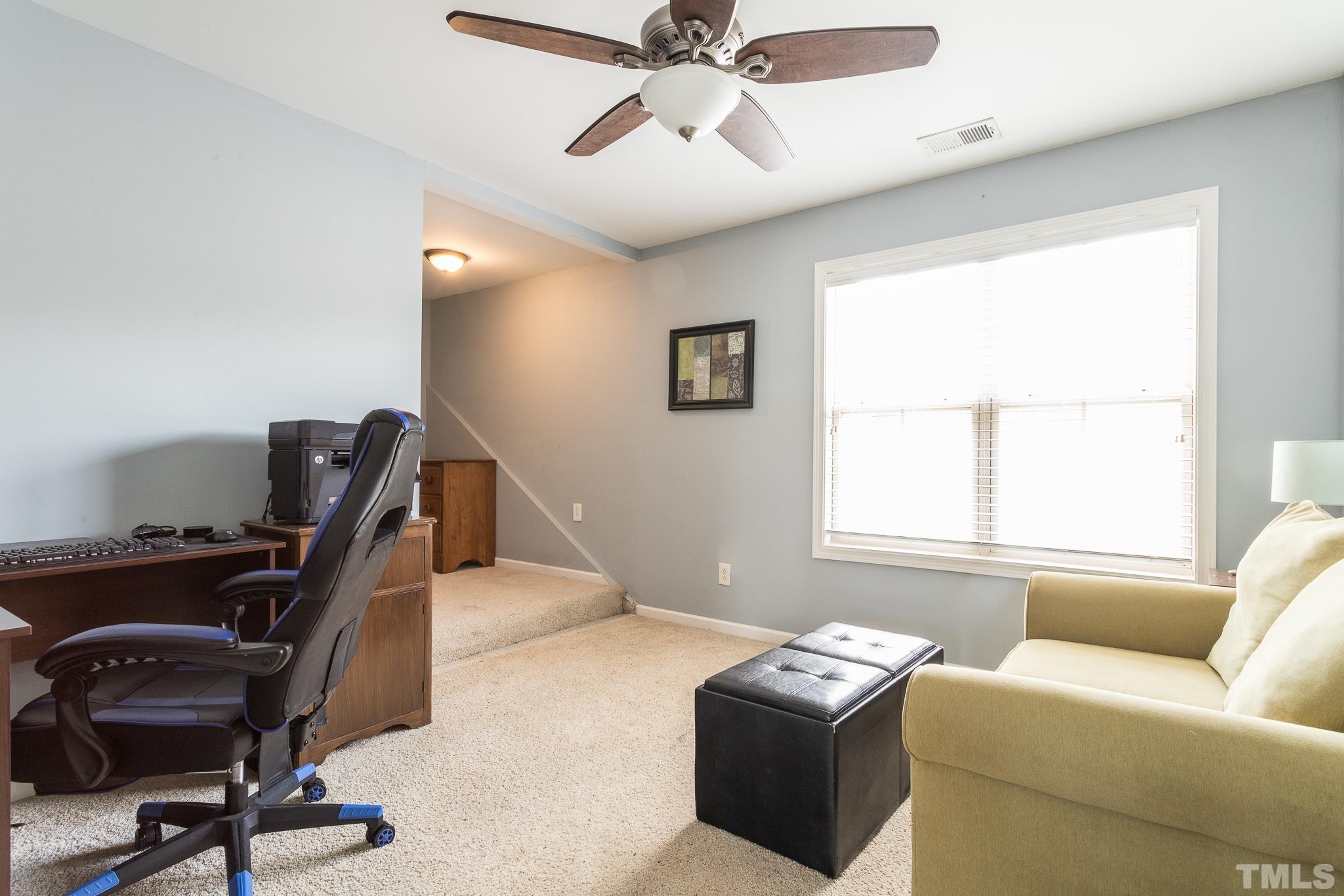 6221 Oconner Street Raleigh, NC 27617 - Photo 19 of 26 a bedroom with furniture and a window