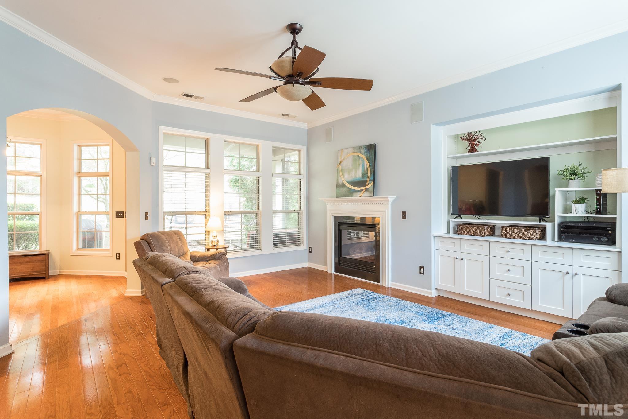 6221 Oconner Street Raleigh, NC 27617 - Photo 5 of 26 a living room with furniture fireplace and flat screen tv
