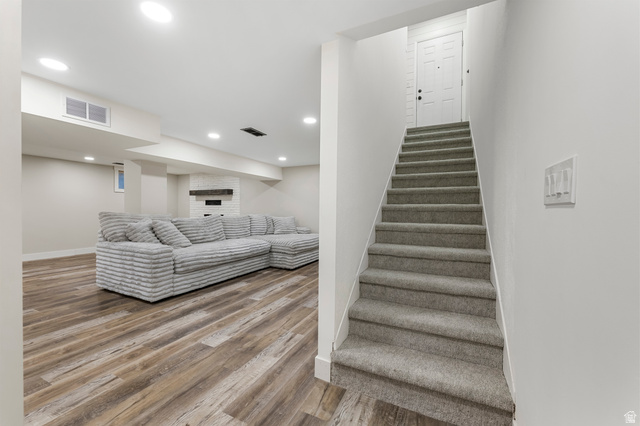 523 South Main Street Payson, UT 84651 - Photo 25 of 41 Carpeted staircase with a white paneled door at the landing